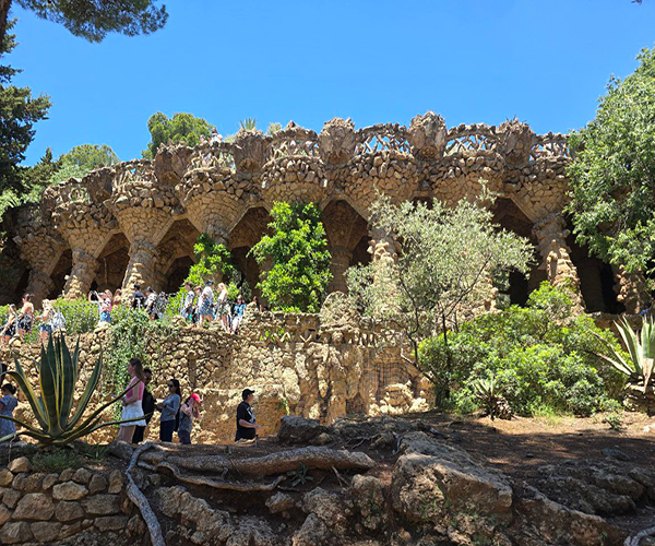 Upper viaduct in Park Guell - stone bridge blending into nature